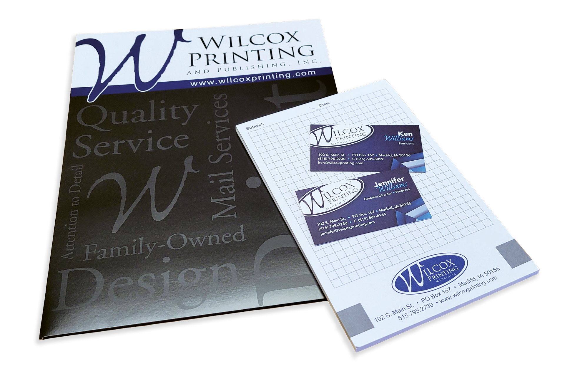 Examples of the WIlcox folder, grid paper, and business cards
